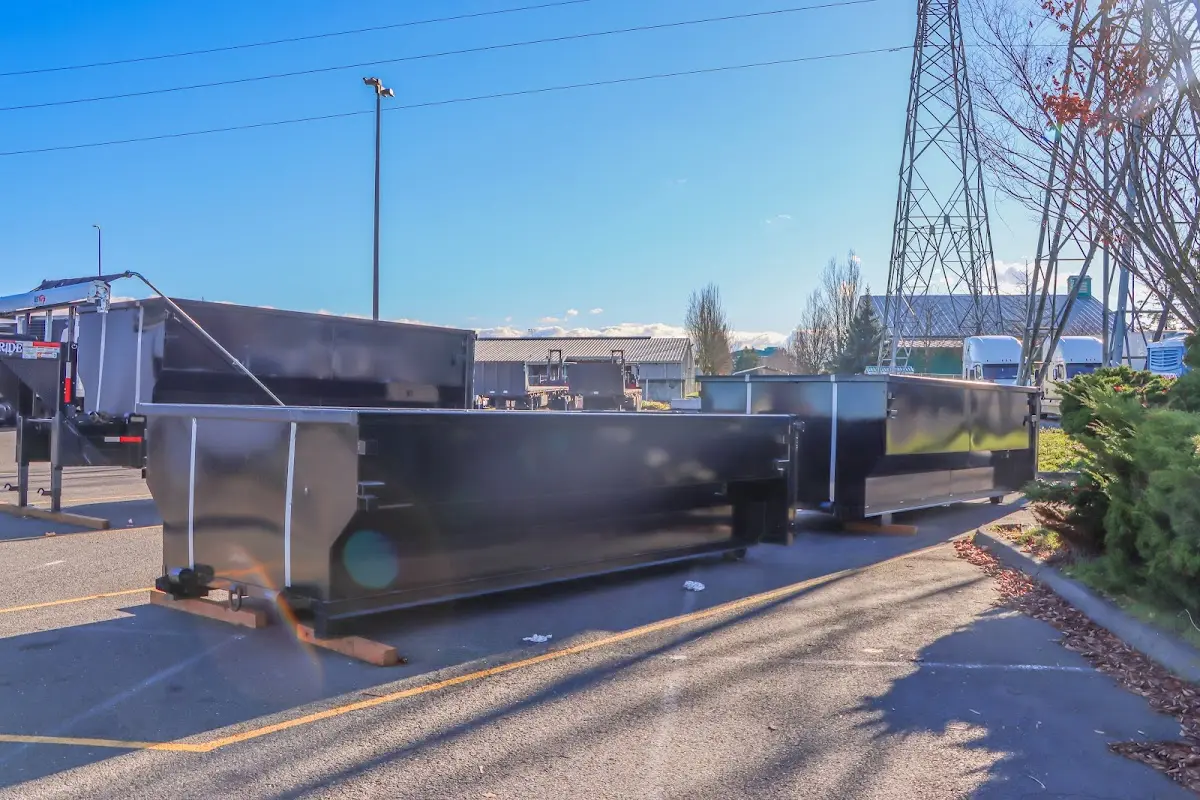 Roll-off dumpster ready for waste disposal at job site for Demolition Dumpster Rental in Forestdale